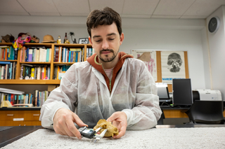 Yale student measuring specimens