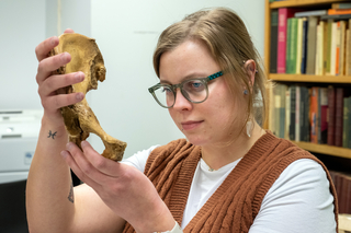 Yale student examines a pelvic bone