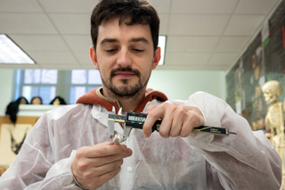 Yale student measuring specimens