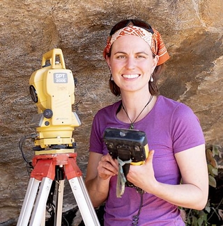 Jessica Thompson operating the total station